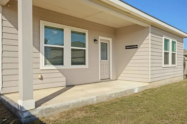 a view of a balcony with white door