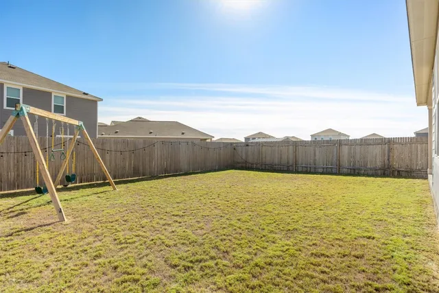 a swimming pool with wooden fence