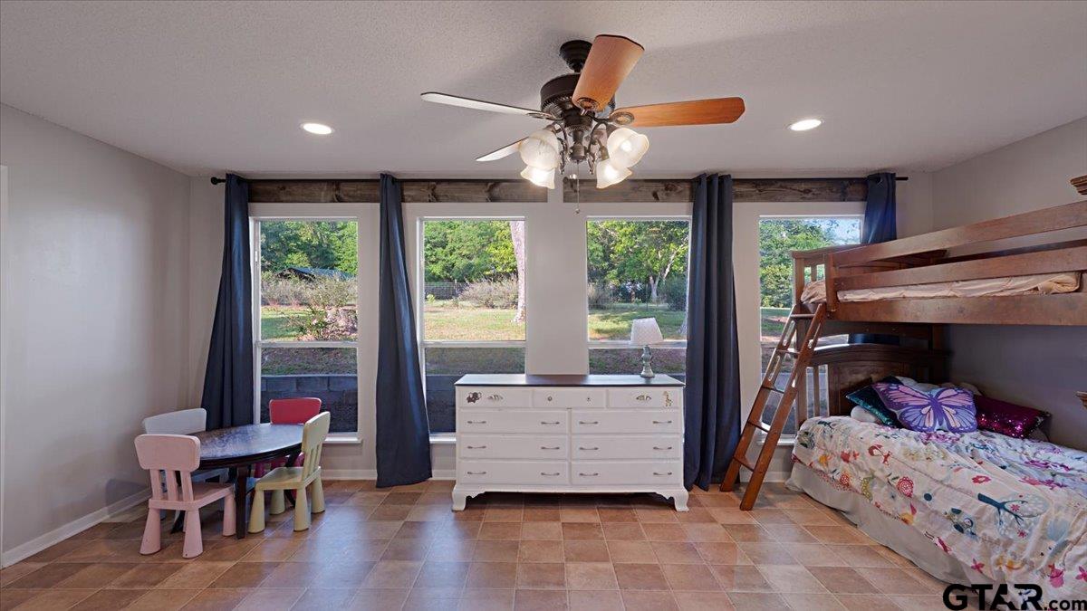 8192 County Road 428 Tyler, TX 75704 - Photo 21 of 38 a bedroom with a bed and a window
