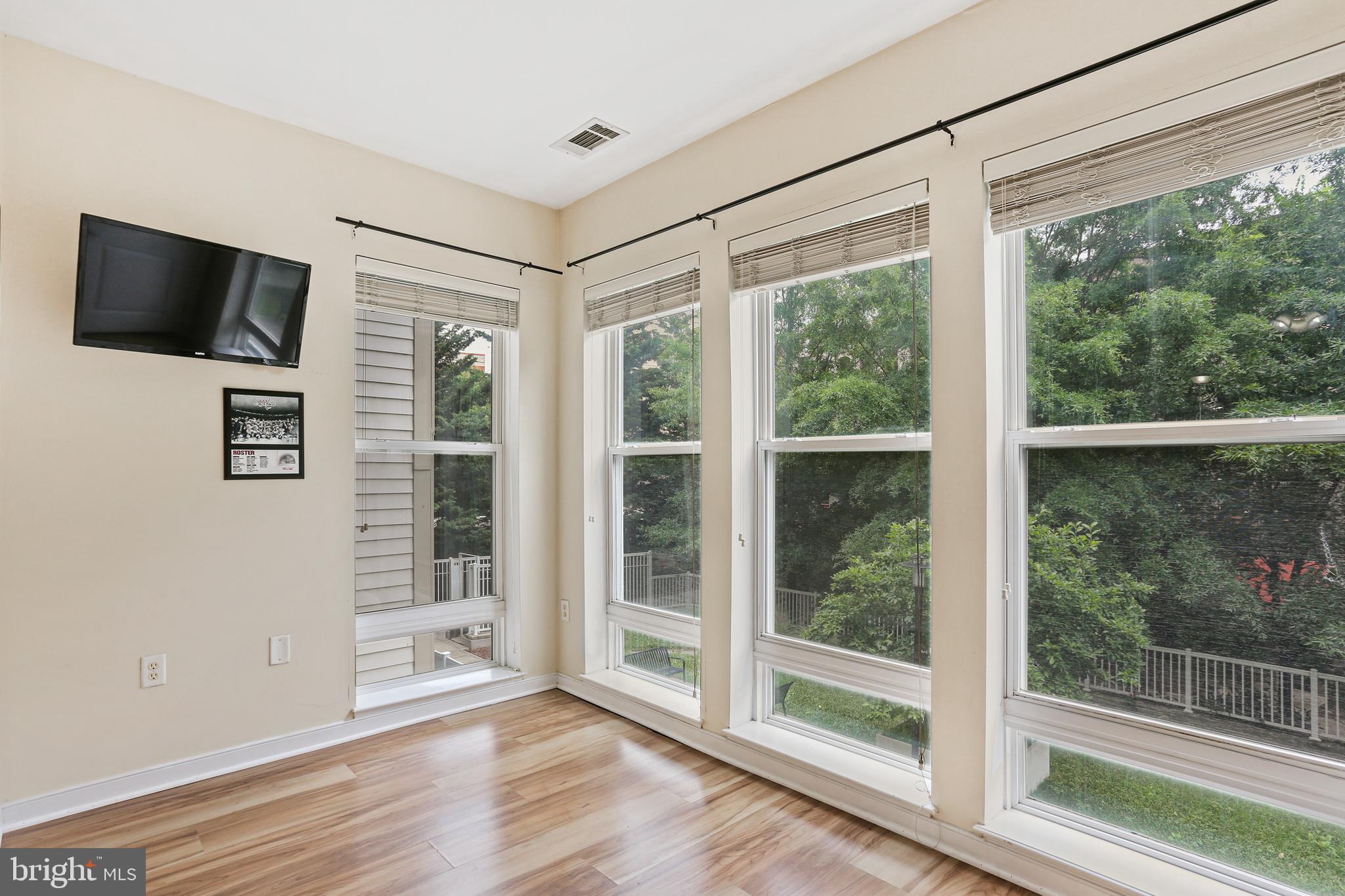 8045 Newell Street, Unit 223 Silver Spring, MD 20910 - Photo 7 of 25 Bright Breakfast Nook /Sunroom
