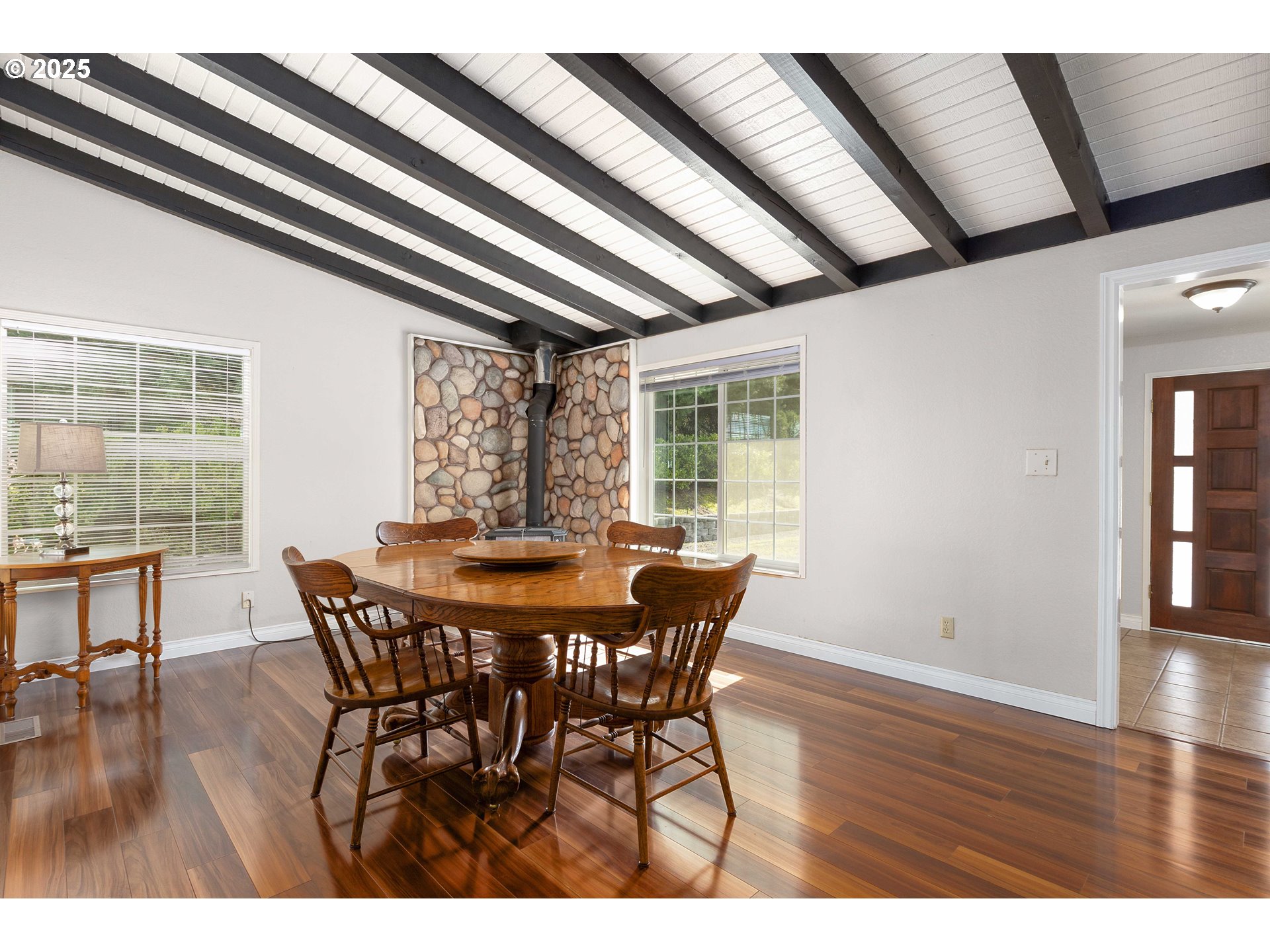 3993 Melqua Road Roseburg, OR 97471 - Photo 17 of 48 a view of a dining room with furniture window and wooden floor