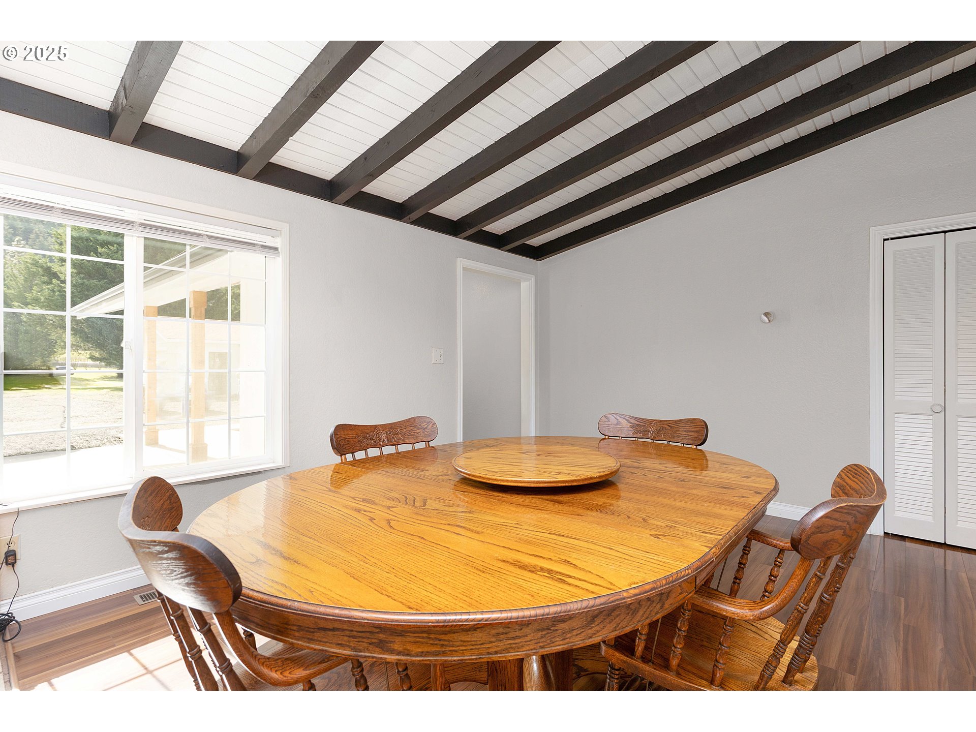 3993 Melqua Road Roseburg, OR 97471 - Photo 18 of 48 a dining room with furniture and wooden floor