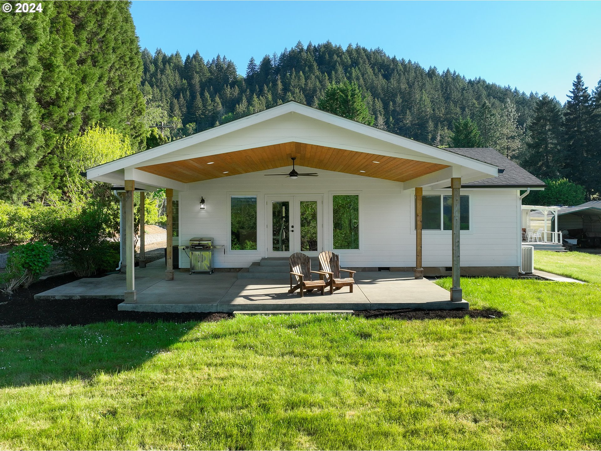3993 Melqua Road Roseburg, OR 97471 - Photo 2 of 48 a view of a house with backyard and sitting area
