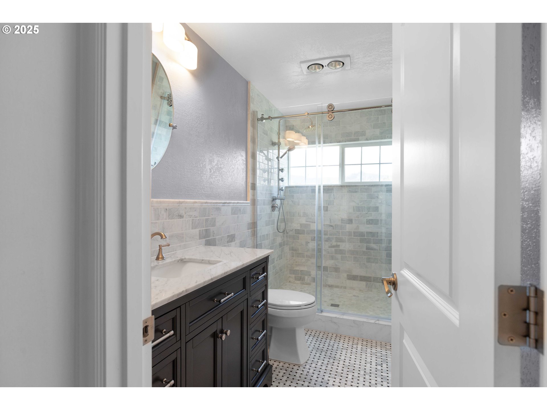 3993 Melqua Road Roseburg, OR 97471 - Photo 40 of 48 a bathroom with a granite countertop sink a toilet a mirror and shower