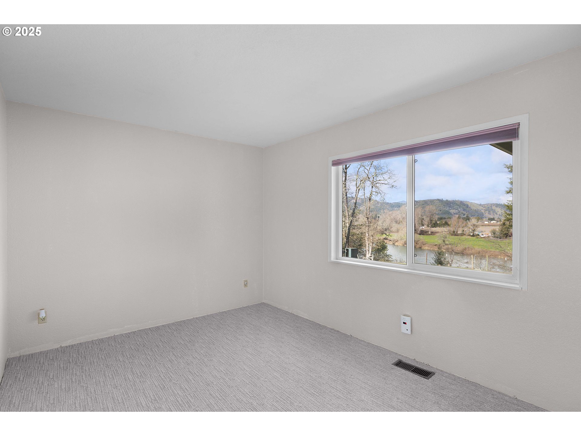 3993 Melqua Road Roseburg, OR 97471 - Photo 41 of 48 a view of an empty room with a window