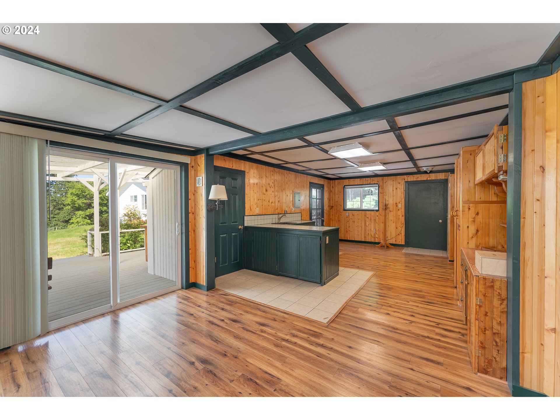 3993 Melqua Road Roseburg, OR 97471 - Photo 45 of 48 a view of an empty room with wooden floor and a window