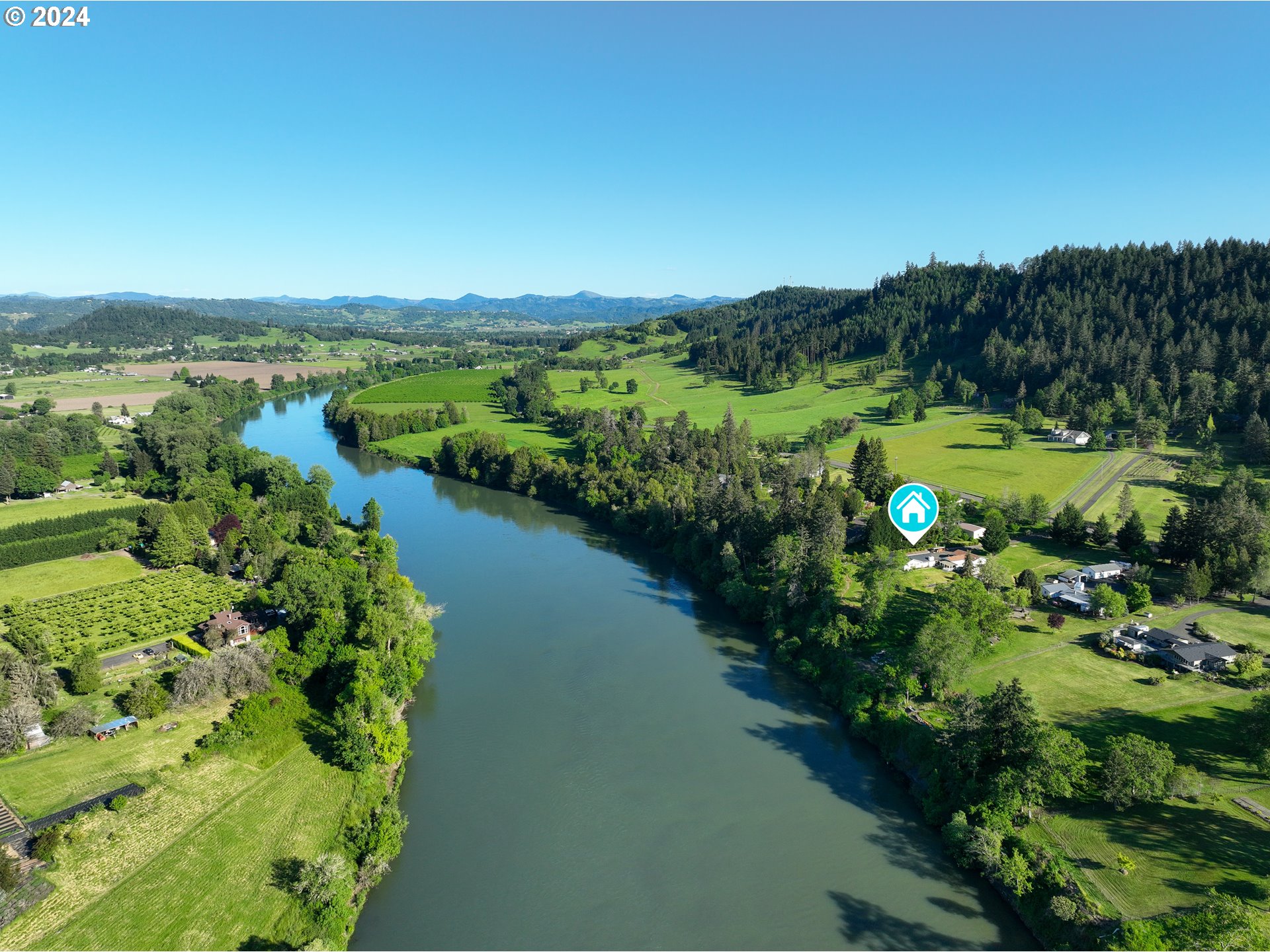 3993 Melqua Road Roseburg, OR 97471 - Photo 5 of 48 a view of a garden with a lake