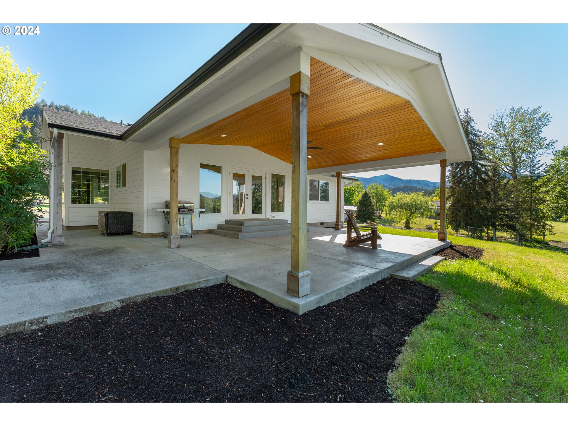 3993 Melqua Road Roseburg, OR 97471 - Photo 7 of 48 a view of a house with backyard and sitting area