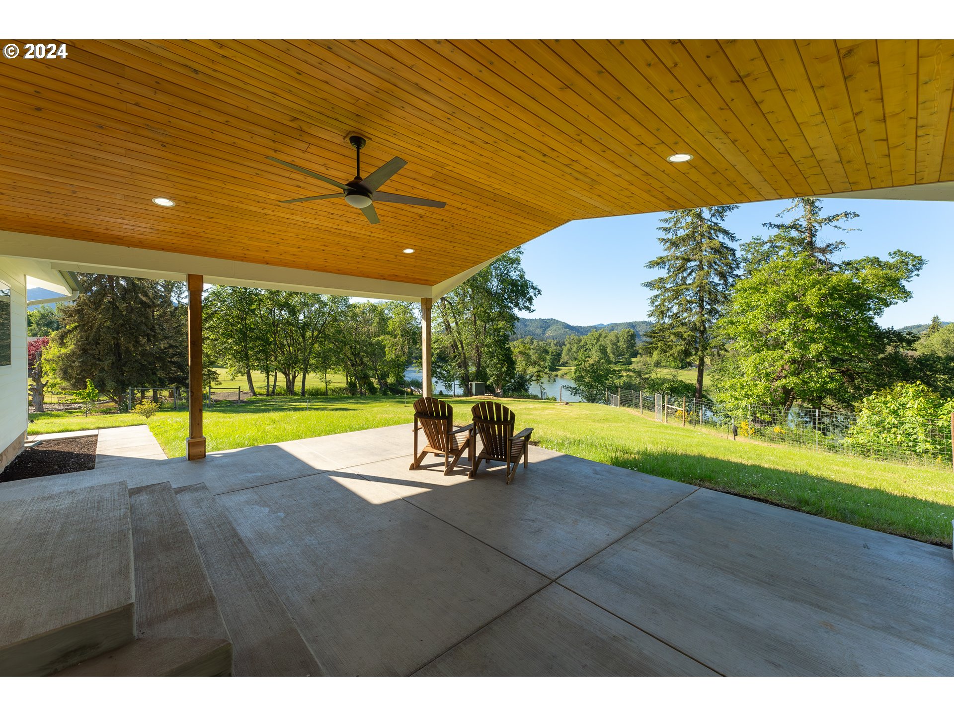 3993 Melqua Road Roseburg, OR 97471 - Photo 8 of 48 a view of a swimming pool with an outdoor seating