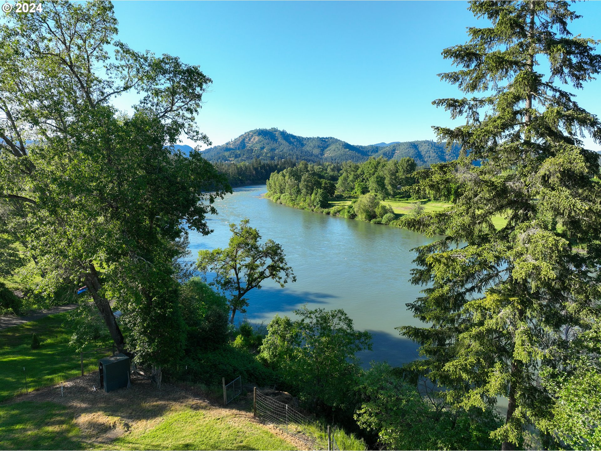 3993 Melqua Road Roseburg, OR 97471 - Photo 10 of 48 a view of a lake with a garden