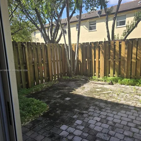 a view of a backyard of the house