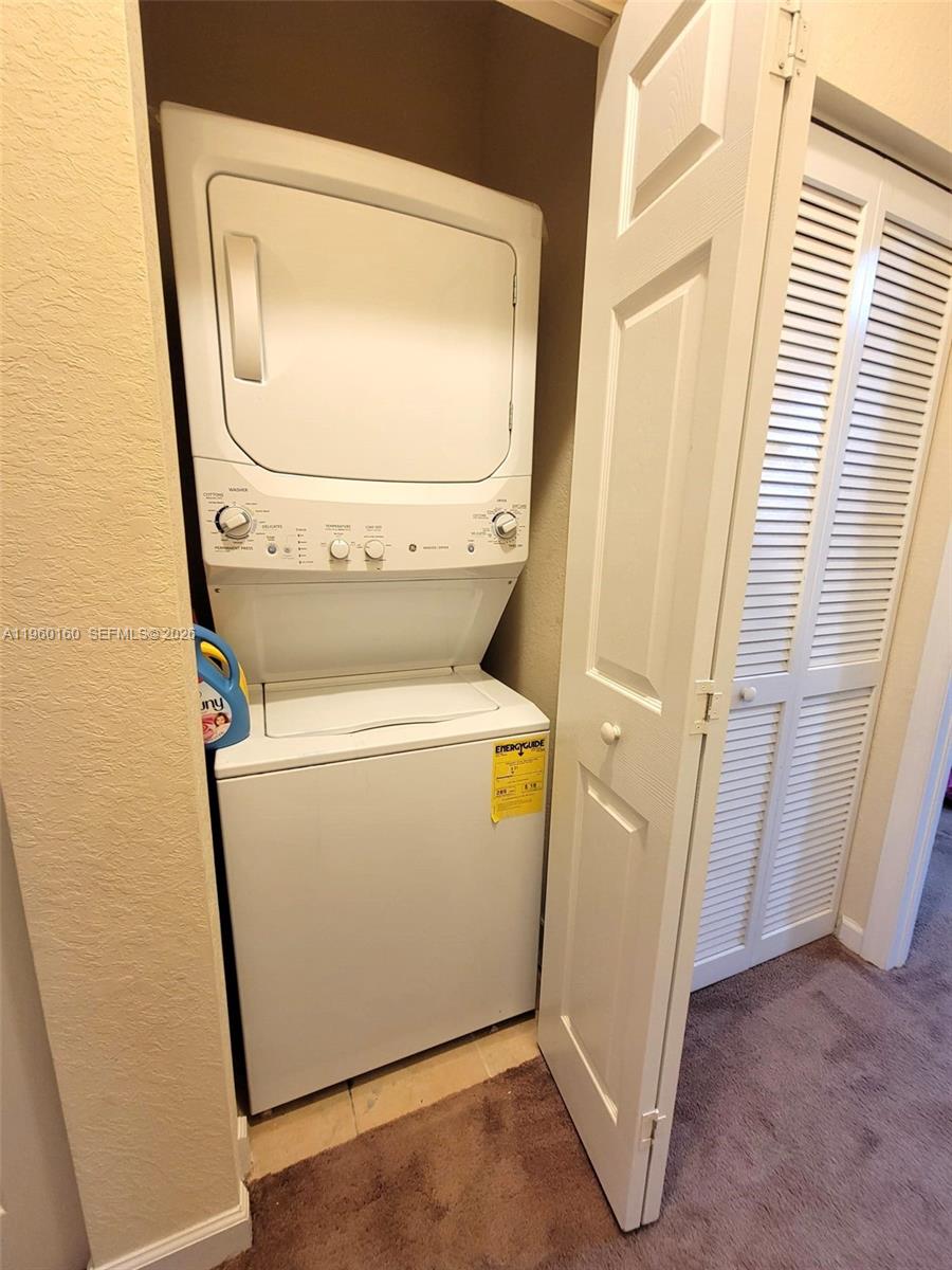 9031 Southwest 227th Street, Unit 5 Cutler Bay, FL 33190 - Photo 16 of 21 a utility room with dryer and washer