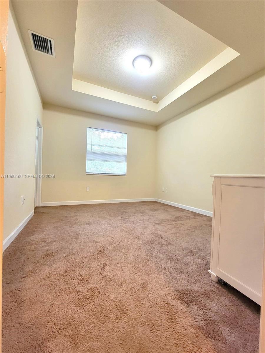 9031 Southwest 227th Street, Unit 5 Cutler Bay, FL 33190 - Photo 20 of 21 an empty room with windows