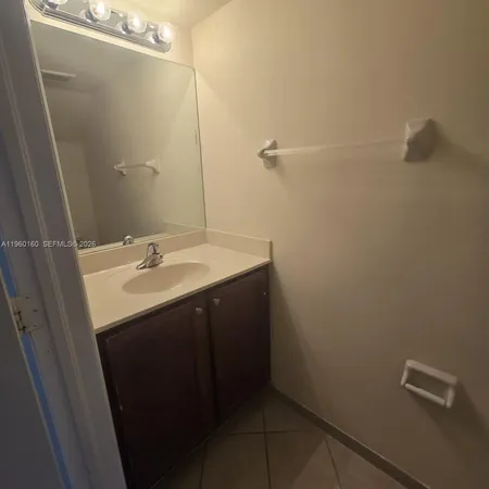 a bathroom with a sink and mirror