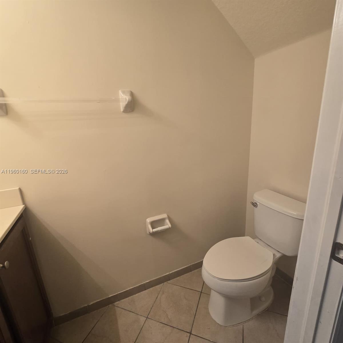 9031 Southwest 227th Street, Unit 5 Cutler Bay, FL 33190 - Photo 7 of 21 a bathroom with a toilet