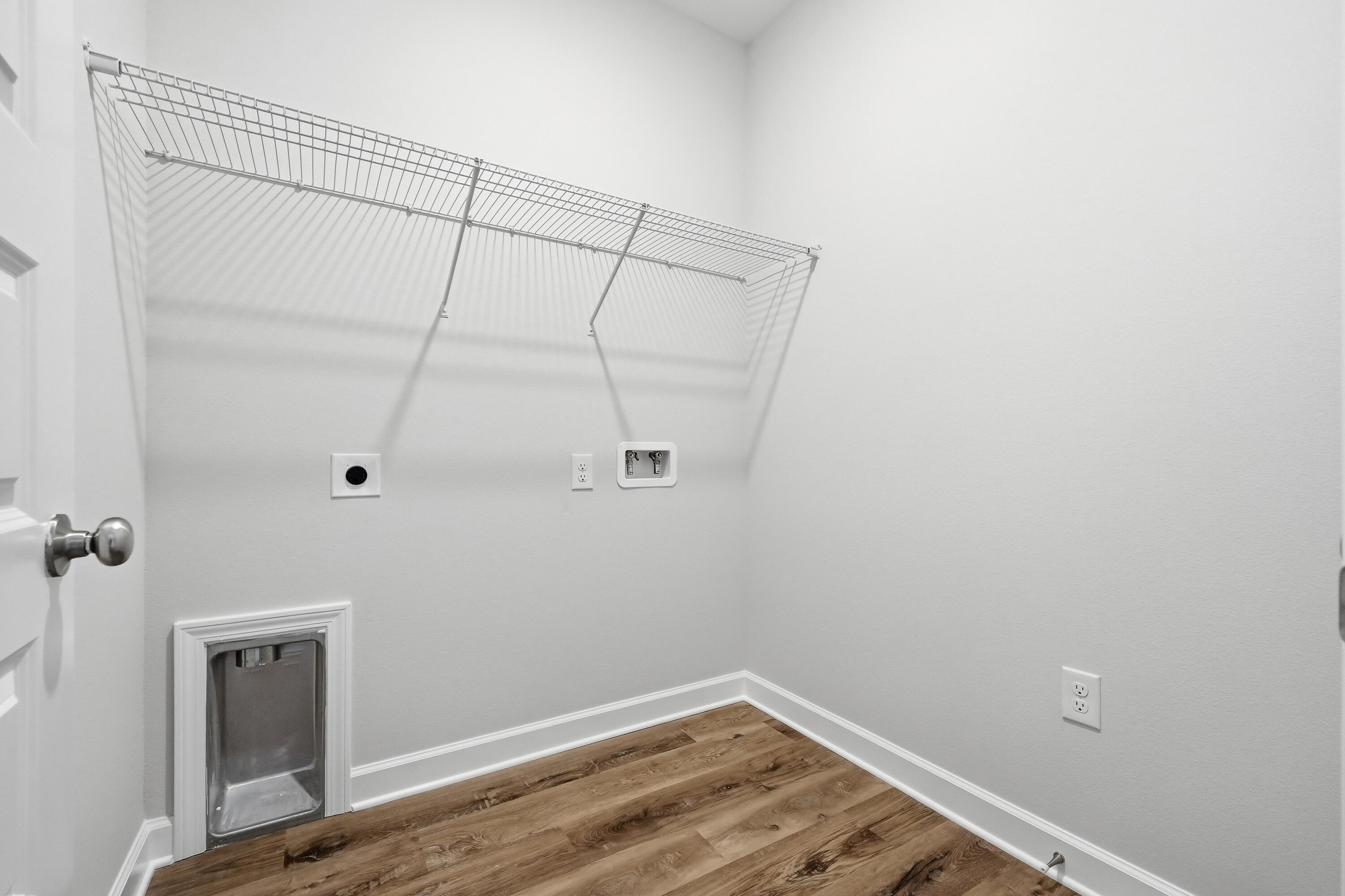 6114 Mildreds Way Crestview, FL 32539 - Photo 21 of 24 a view of a room with wooden floor and closet