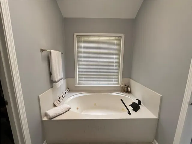 a bathroom with a bathtub and a sink