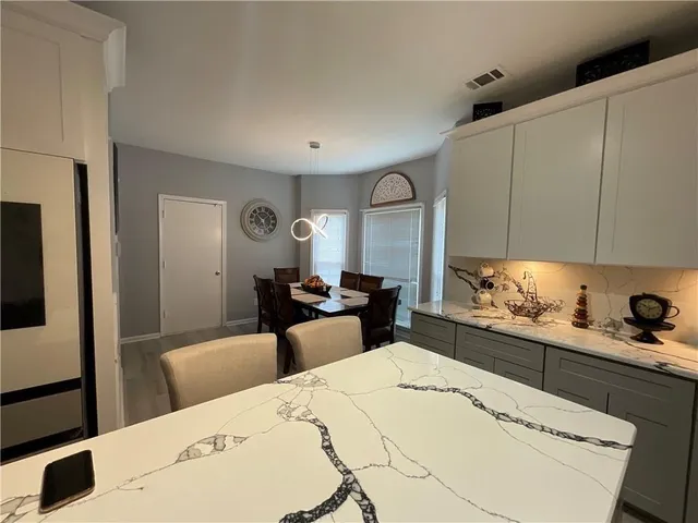 a bed room with a bed and a television