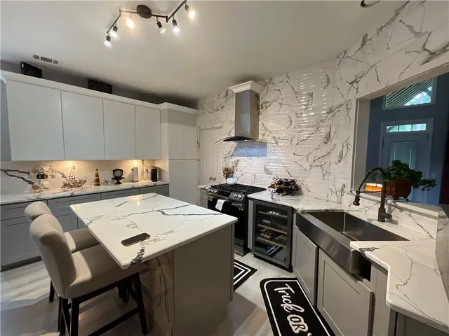 a kitchen that has a sink and a stove