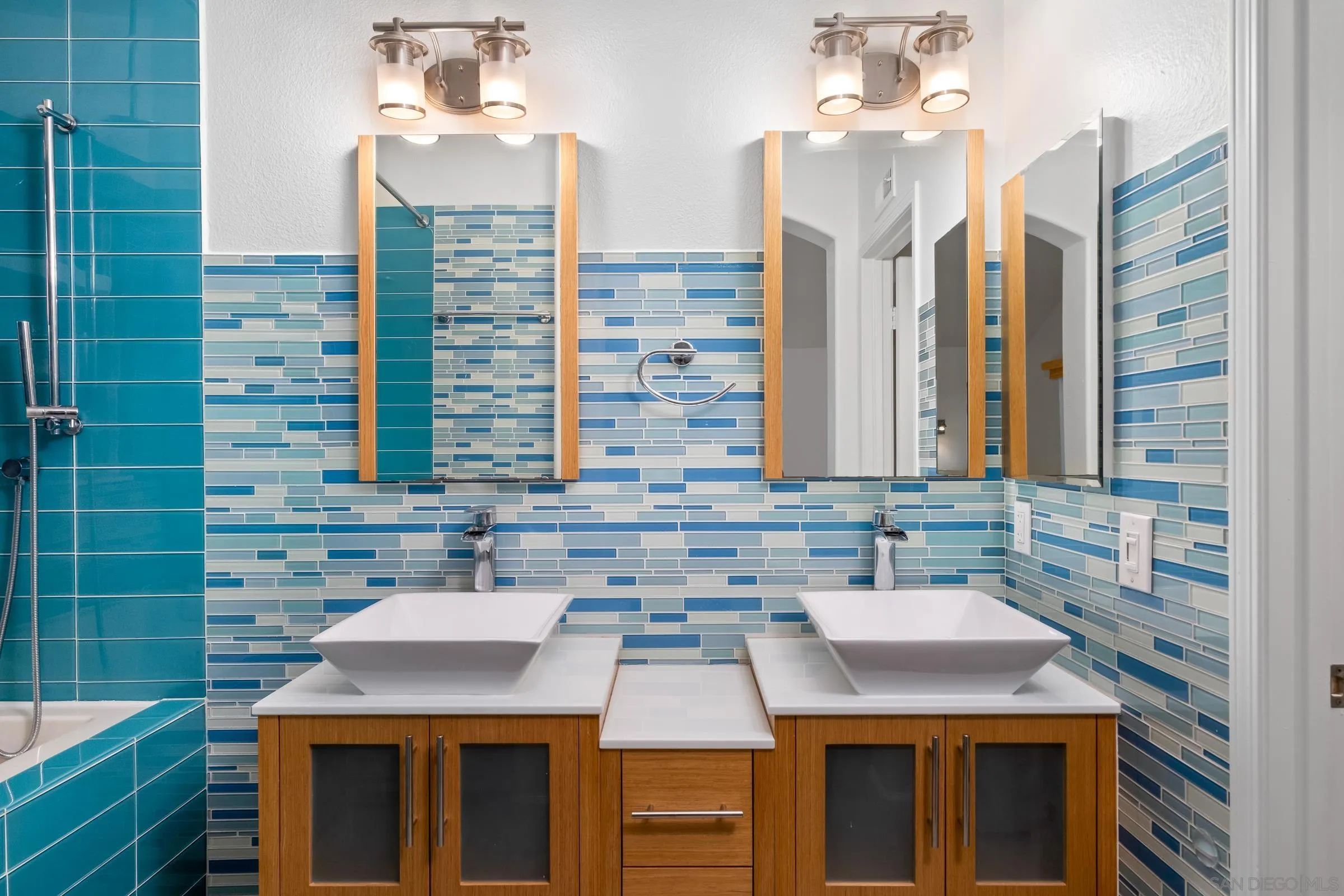 536 Kiley Road Chula Vista, CA 91910 - Photo 13 of 46 a bathroom with a sink and a mirror