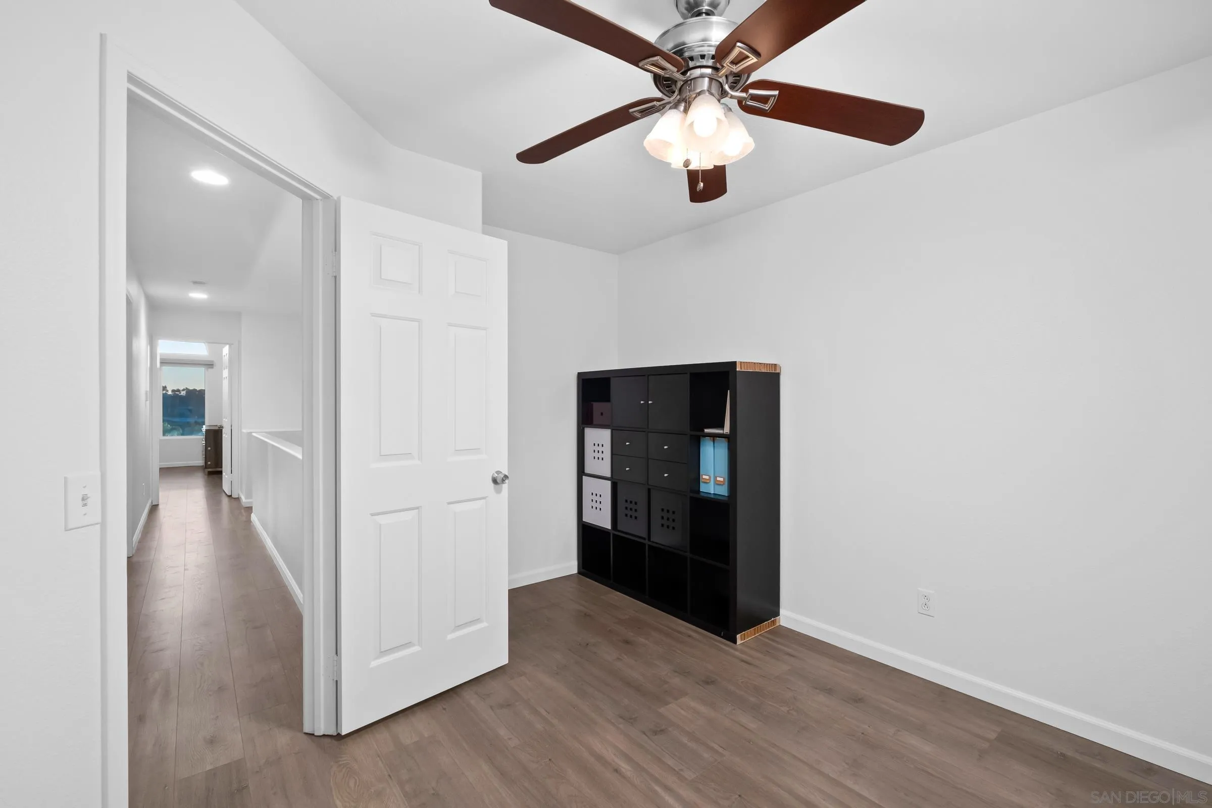 536 Kiley Road Chula Vista, CA 91910 - Photo 30 of 46 an empty room with wooden floor fan and windows