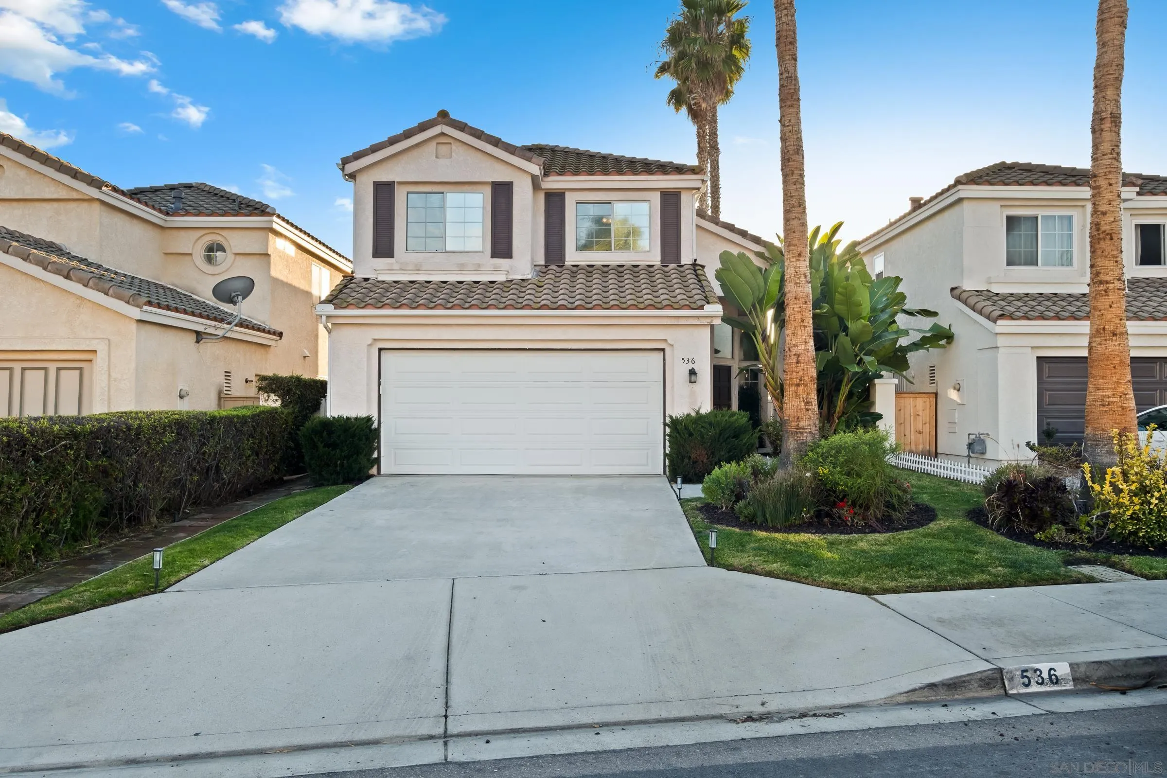 536 Kiley Road Chula Vista, CA 91910 - Photo 42 of 46 a front view of a house with a yard and garage