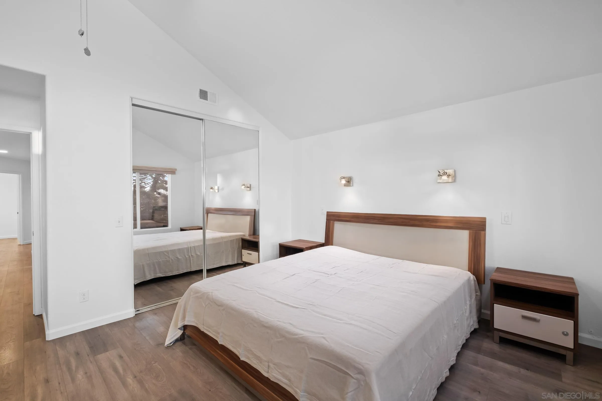 536 Kiley Road Chula Vista, CA 91910 - Photo 10 of 46 a bedroom with a bed and a chandelier