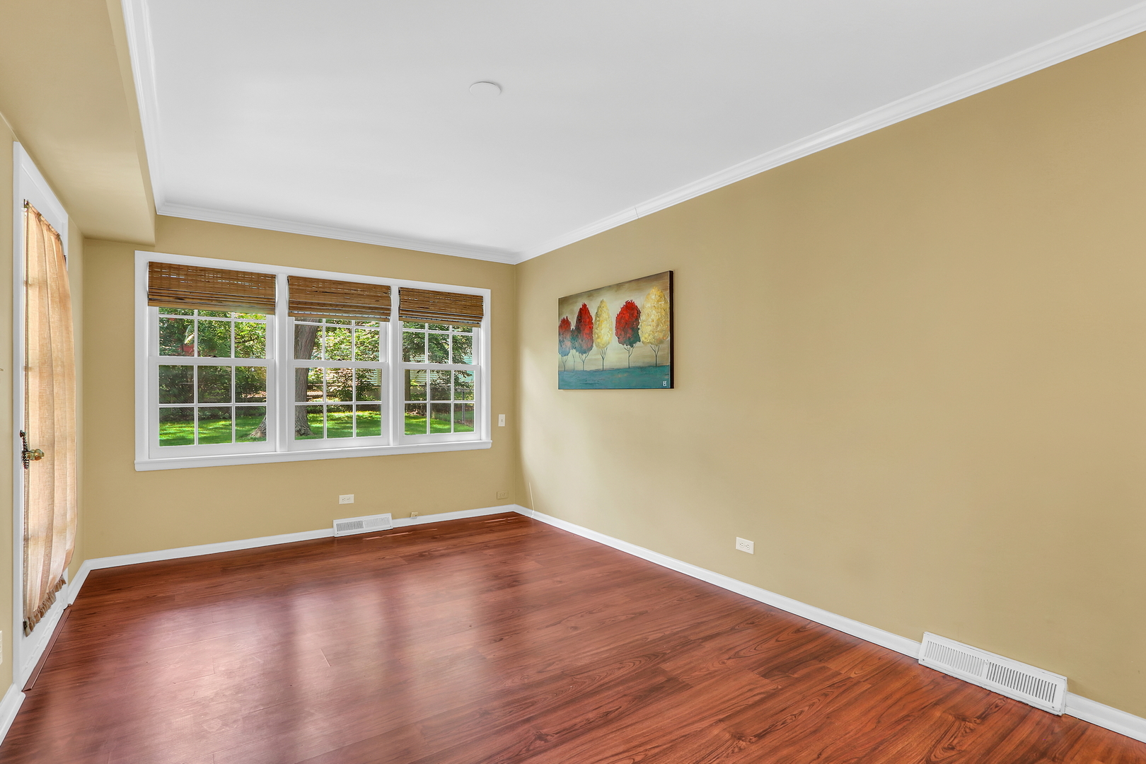 219 East Rockland Road Libertyville, IL 60048 - Photo 12 of 23 a view of empty room with wooden floor and fan