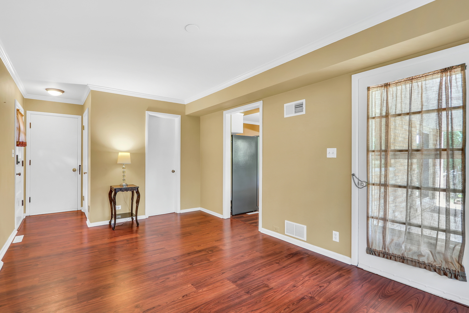 219 East Rockland Road Libertyville, IL 60048 - Photo 13 of 23 a view of a big room with wooden floor and windows