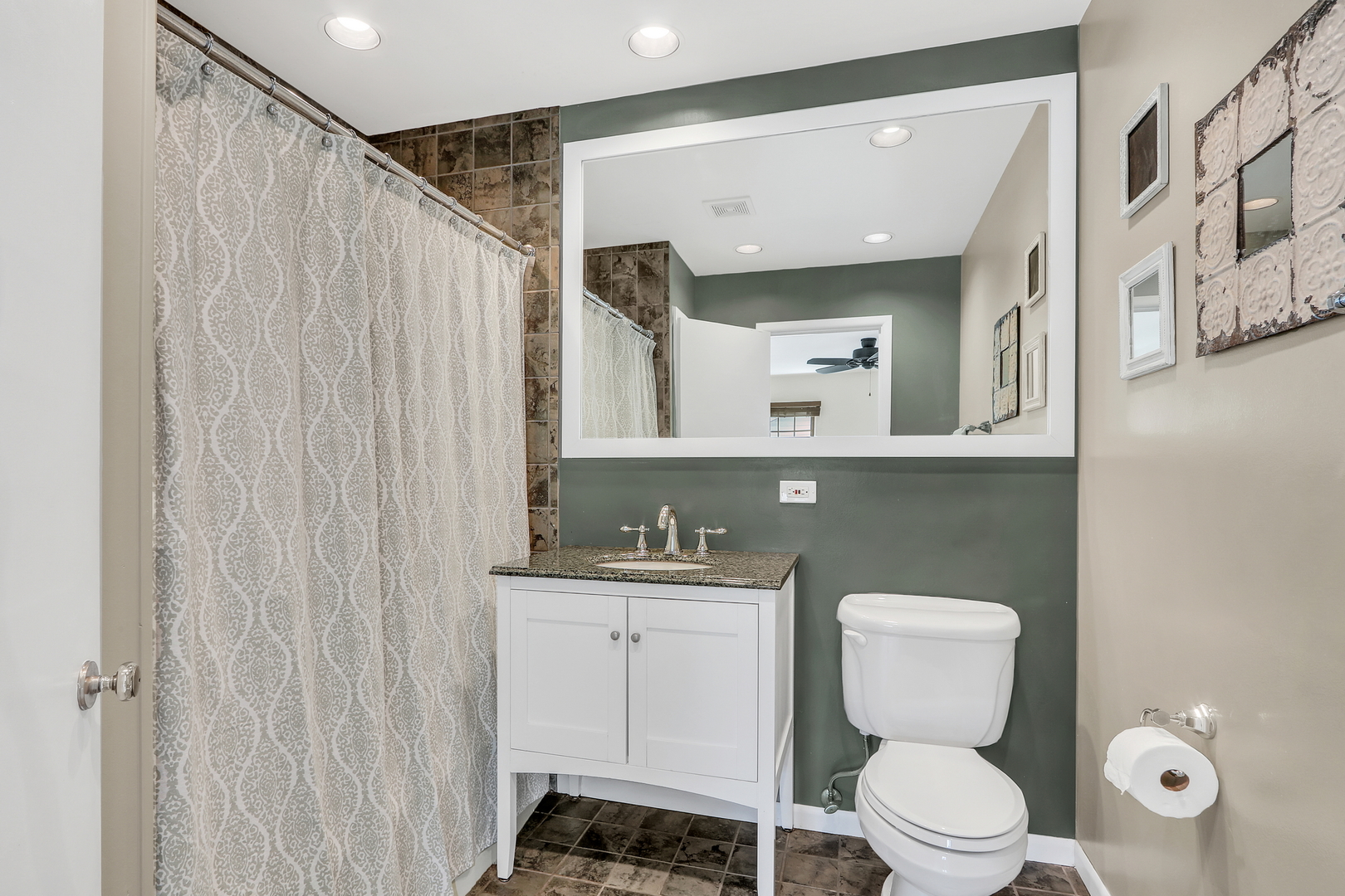 219 East Rockland Road Libertyville, IL 60048 - Photo 16 of 23 a bathroom with a toilet a sink and a mirror