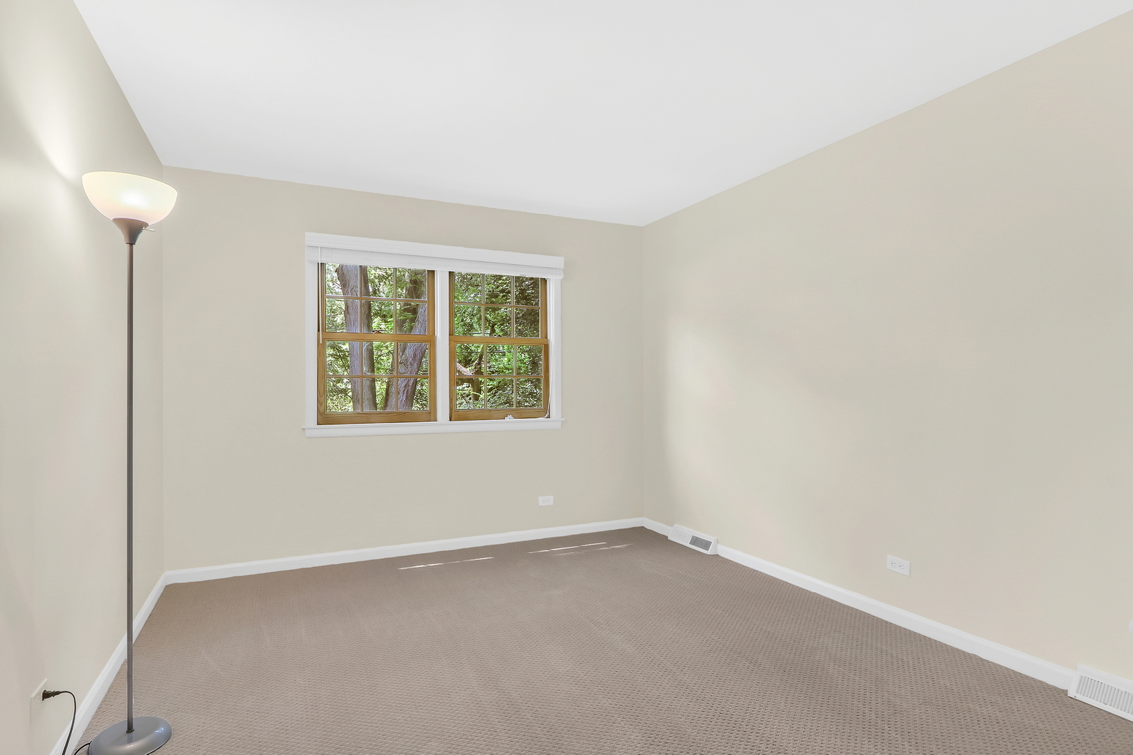 219 East Rockland Road Libertyville, IL 60048 - Photo 18 of 23 an empty room with windows