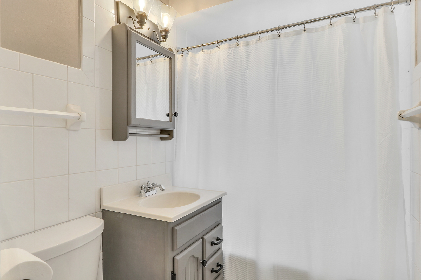 219 East Rockland Road Libertyville, IL 60048 - Photo 20 of 23 a bathroom with a sink and a mirror