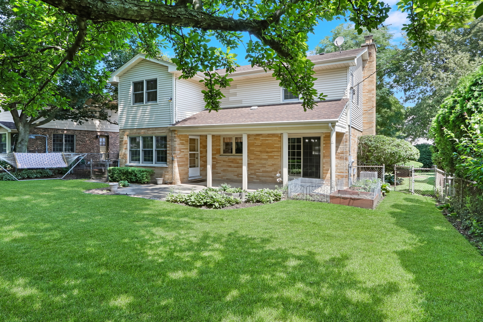 219 East Rockland Road Libertyville, IL 60048 - Photo 22 of 23 a front view of a house with a yard and green space