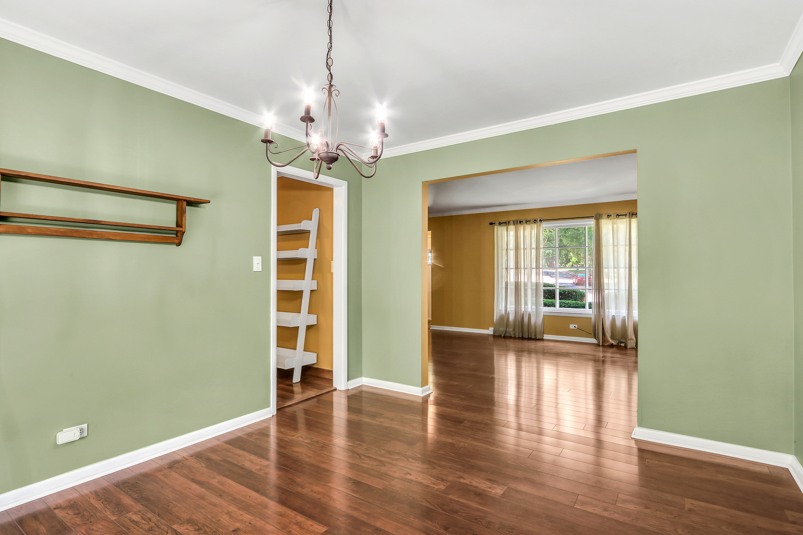 219 East Rockland Road Libertyville, IL 60048 - Photo 8 of 23 a view of an empty room with wooden floor and a window