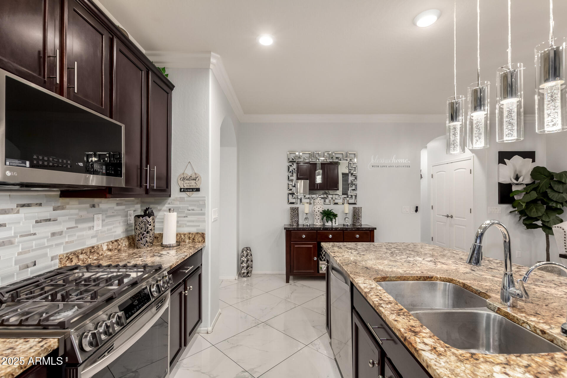 6641 West Georgetown Way Florence, AZ 85132 - Photo 13 of 35 a kitchen with granite countertop a sink and a stove top oven