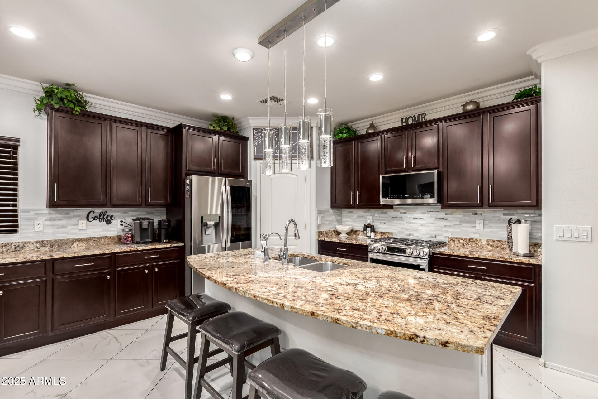 6641 West Georgetown Way Florence, AZ 85132 - Photo 14 of 35 a kitchen with granite countertop a sink stove and refrigerator with wooden floor