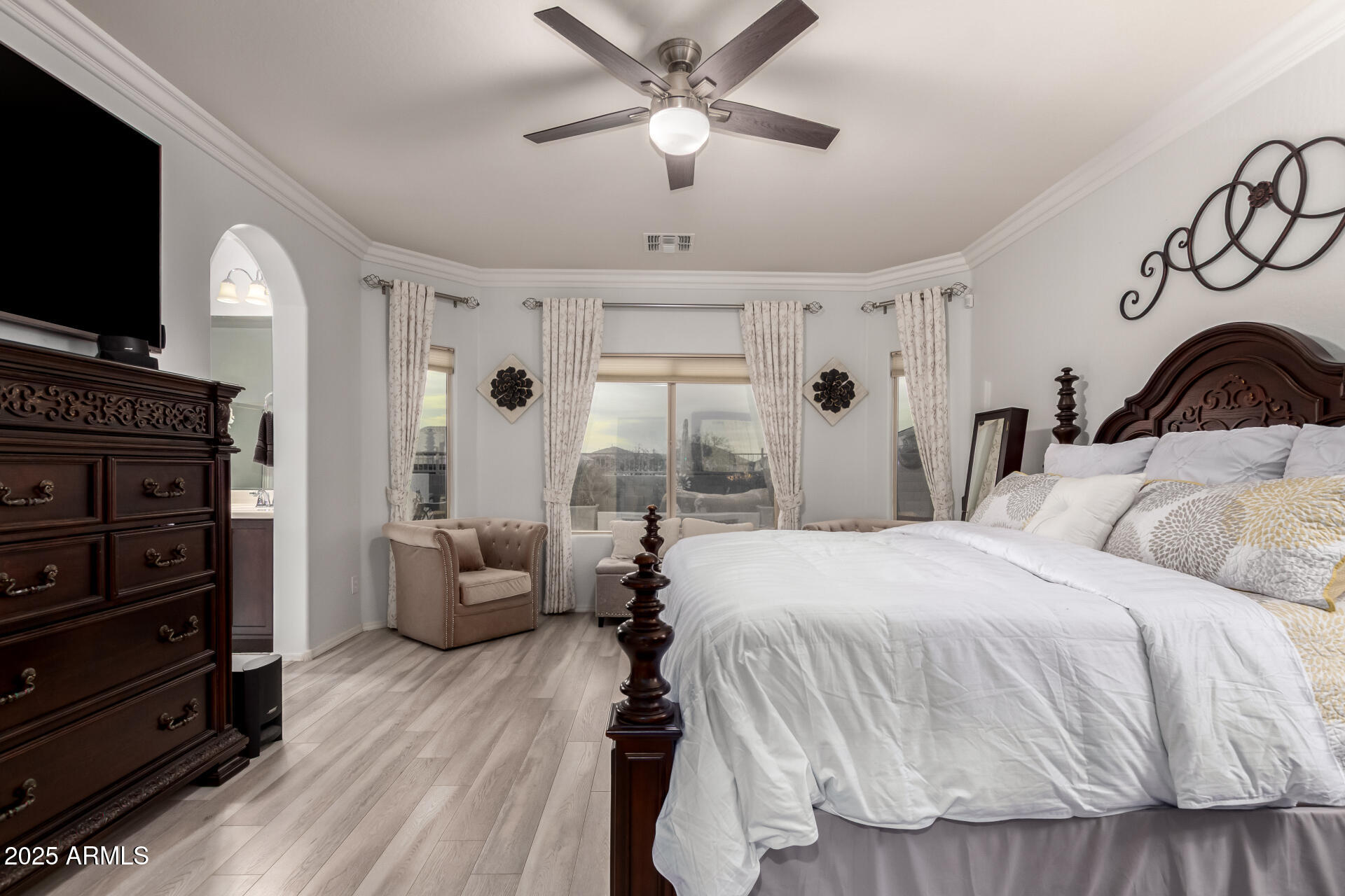 6641 West Georgetown Way Florence, AZ 85132 - Photo 16 of 35 a bedroom with a bed and a flat screen tv