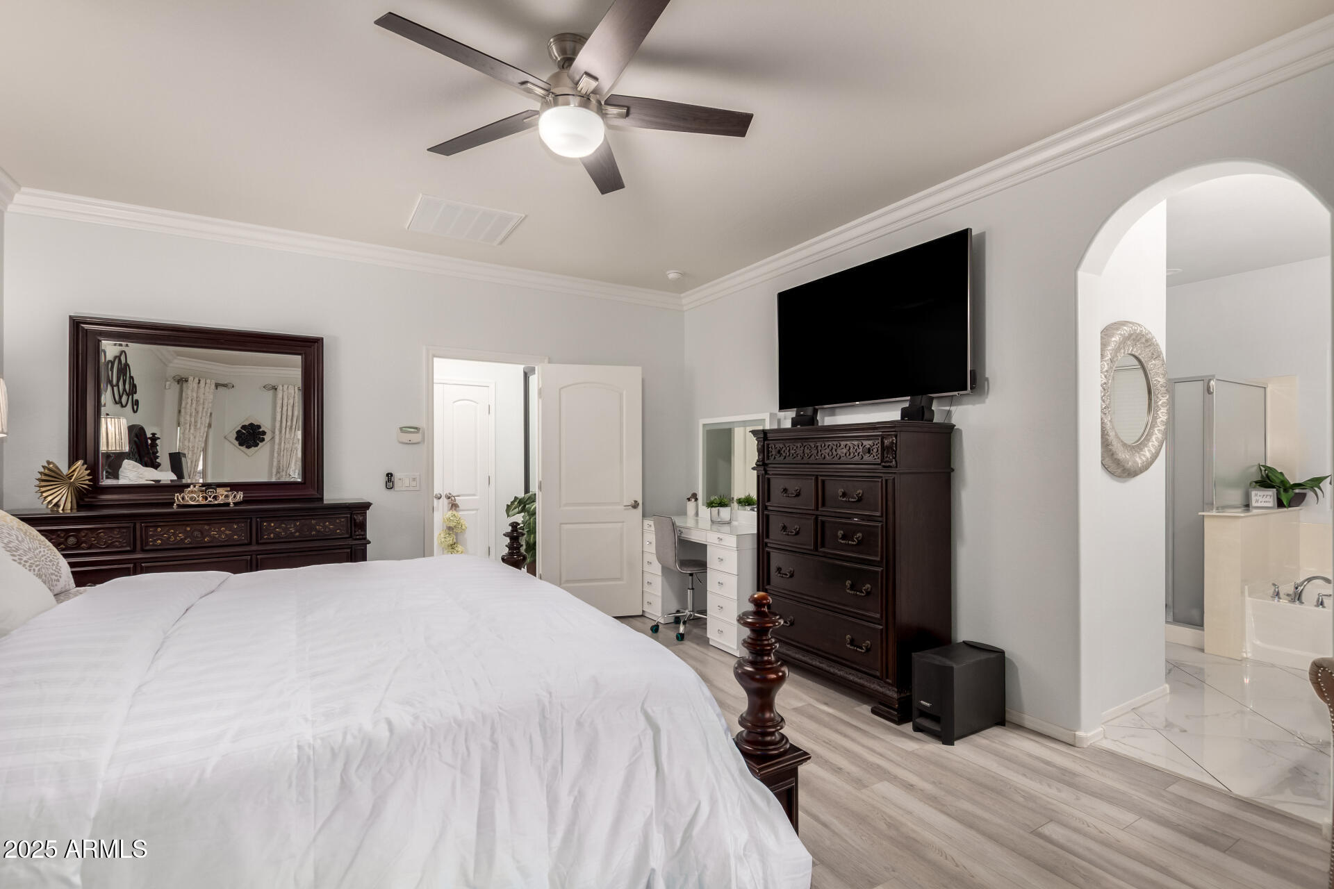 6641 West Georgetown Way Florence, AZ 85132 - Photo 17 of 35 a bedroom with a bed and a flat screen tv