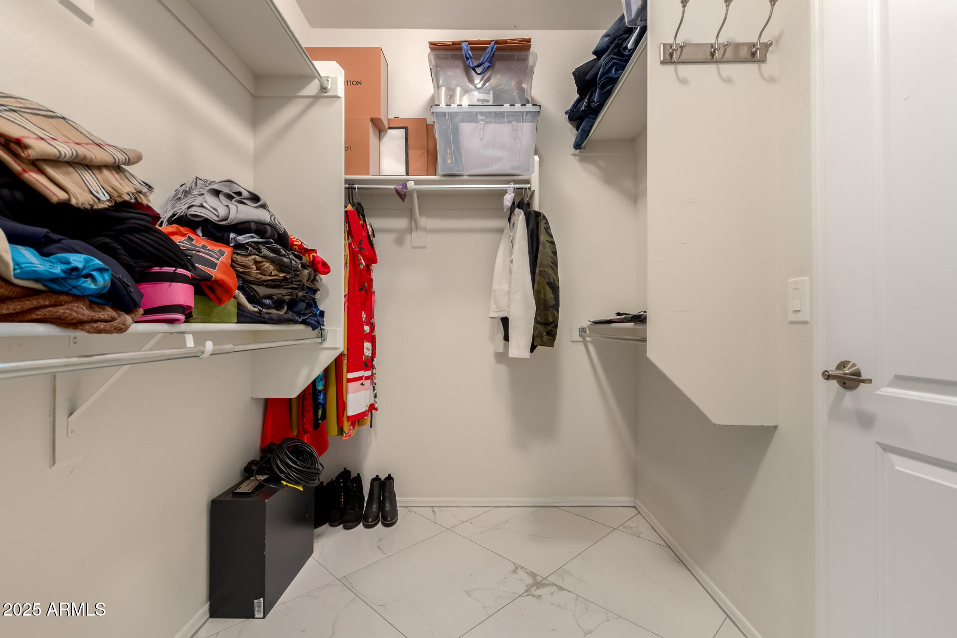 6641 West Georgetown Way Florence, AZ 85132 - Photo 20 of 35 a view of walk in closet with clothes and shoes