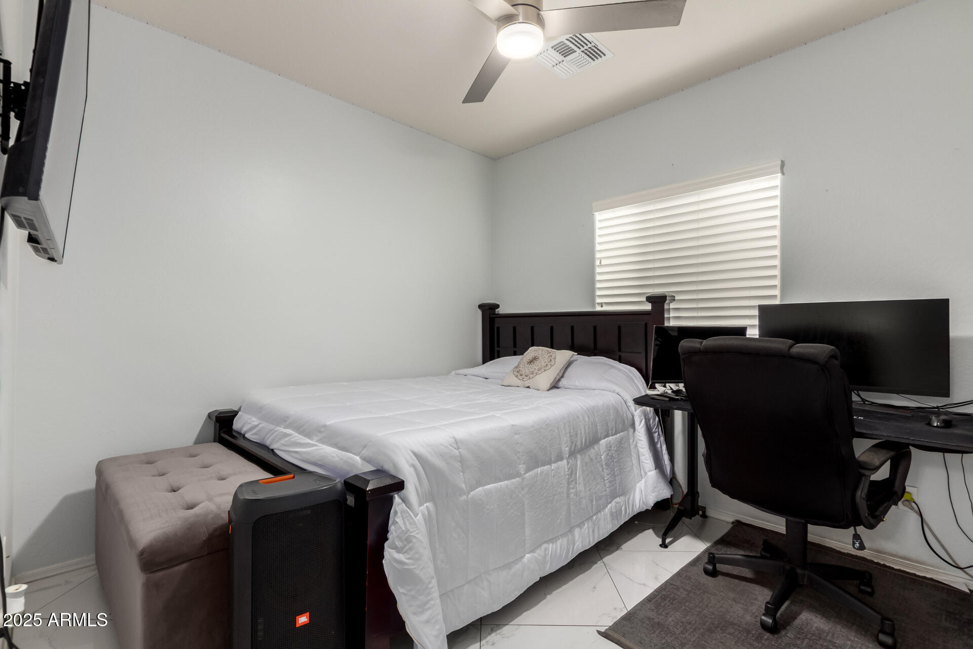 6641 West Georgetown Way Florence, AZ 85132 - Photo 23 of 35 a bedroom with a bed and a chair