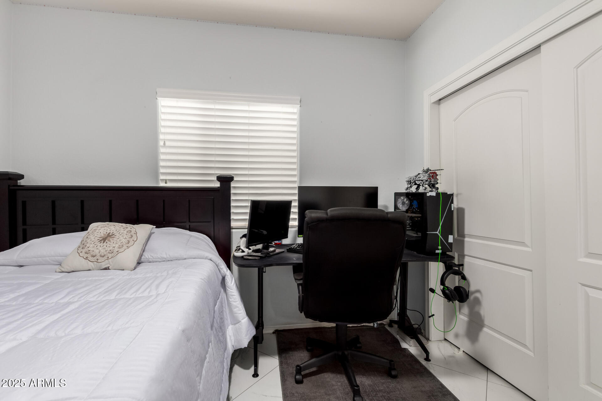 6641 West Georgetown Way Florence, AZ 85132 - Photo 24 of 35 a bedroom with a bed and a table