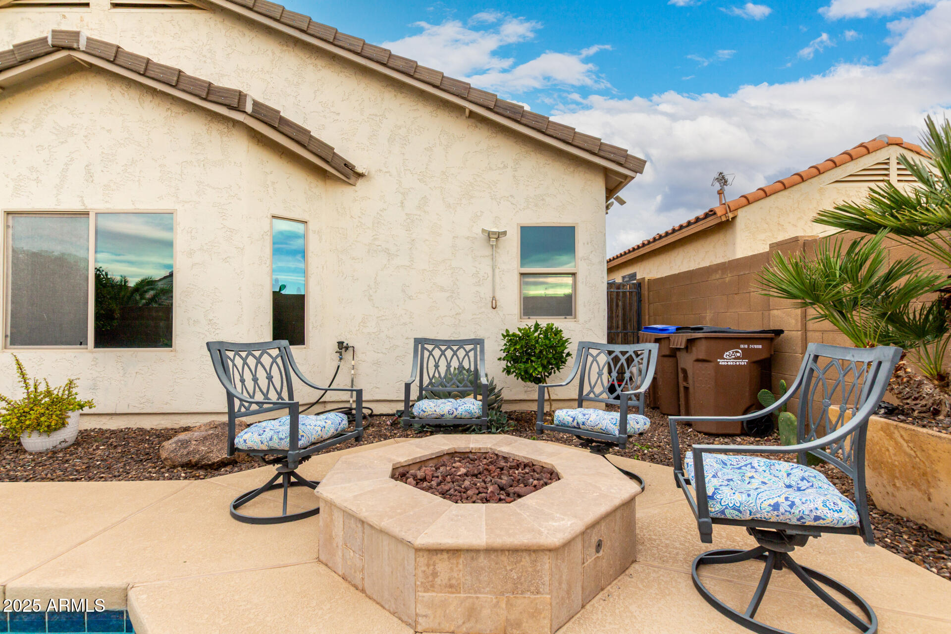 6641 West Georgetown Way Florence, AZ 85132 - Photo 34 of 35 a view of a dinning table and chair in backyard of the house