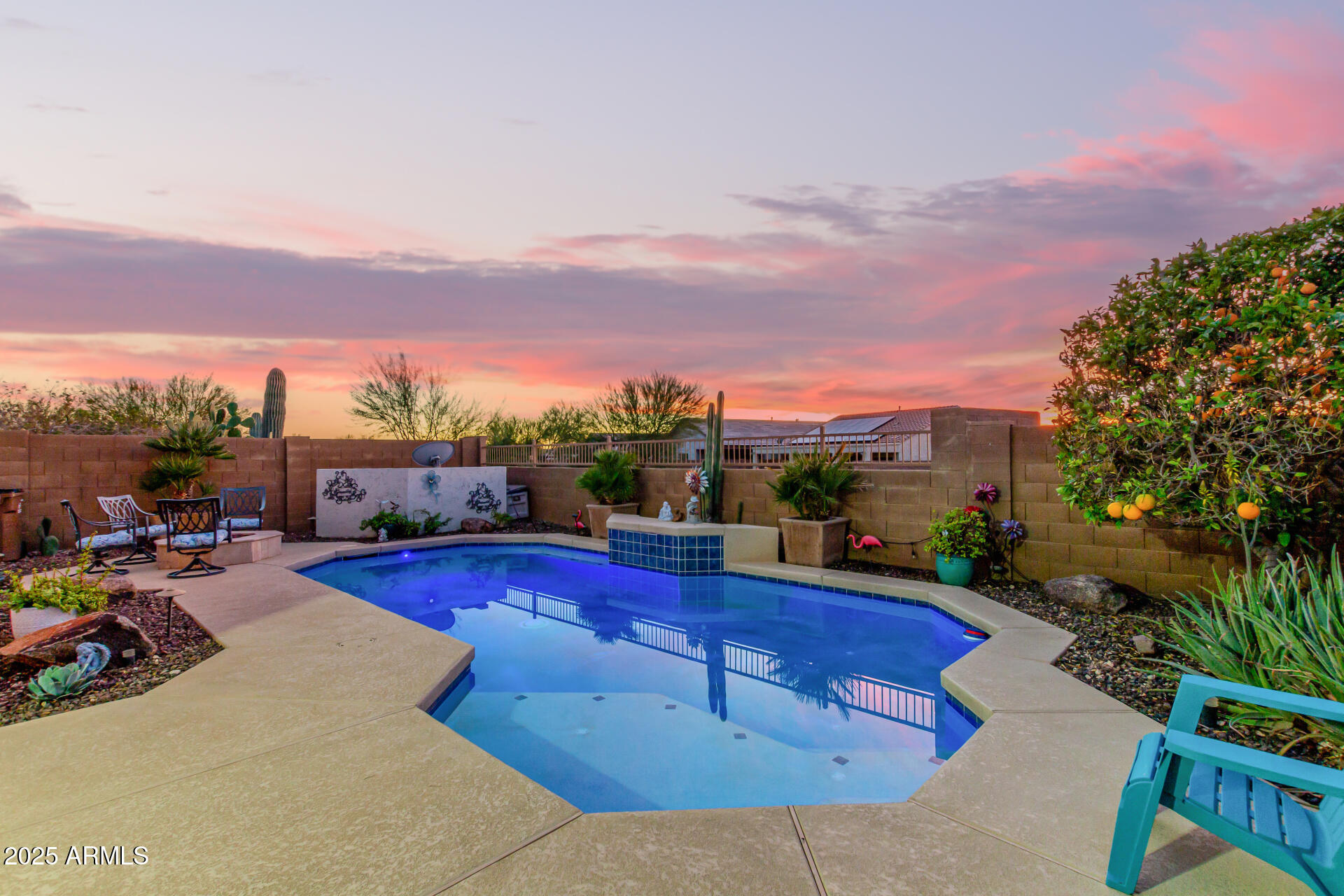 6641 West Georgetown Way Florence, AZ 85132 - Photo 35 of 35 a view of a swimming pool with a table and chairs