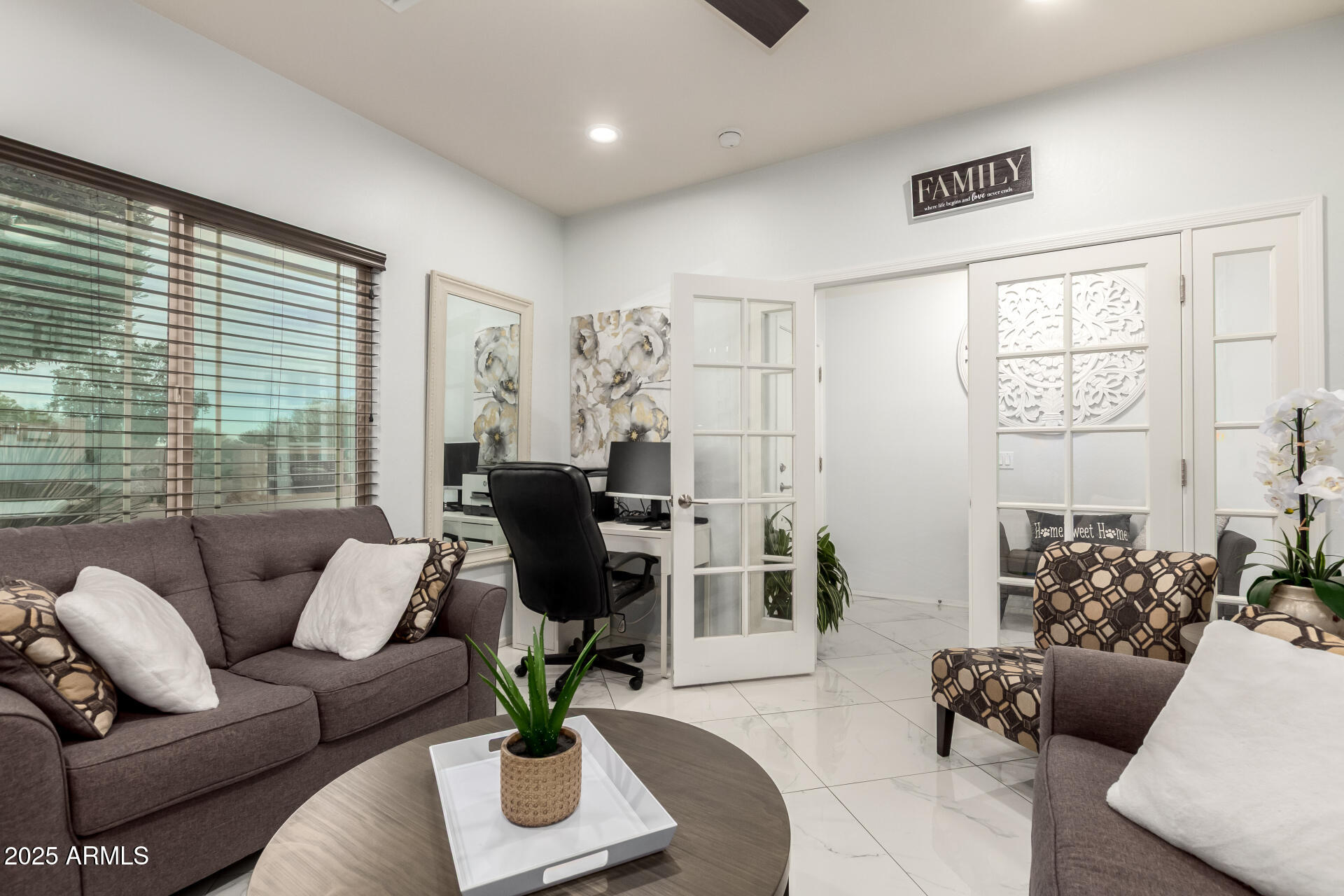 6641 West Georgetown Way Florence, AZ 85132 - Photo 5 of 35 a living room with furniture and a large window
