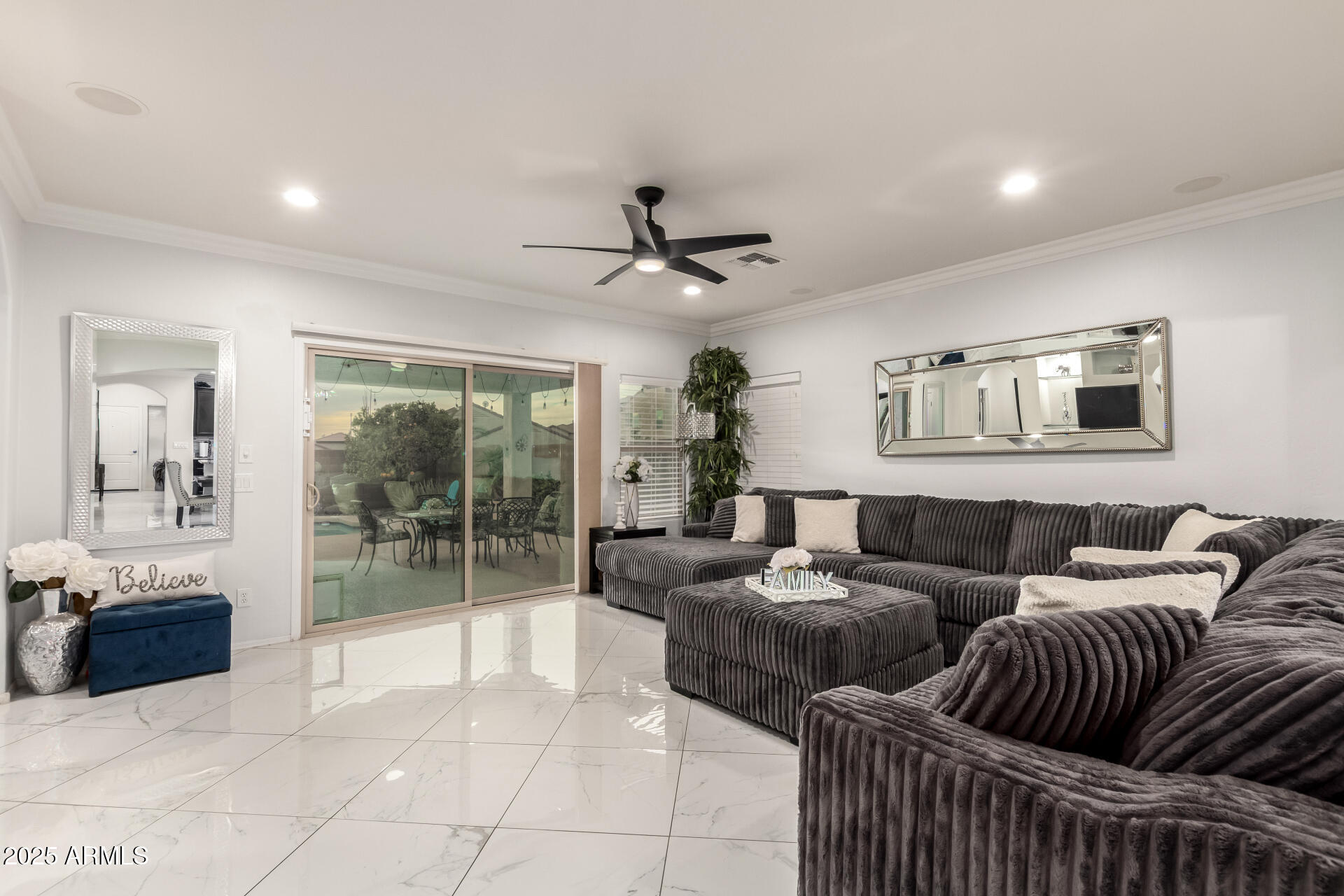 6641 West Georgetown Way Florence, AZ 85132 - Photo 7 of 35 a living room with furniture a ceiling fan and a window