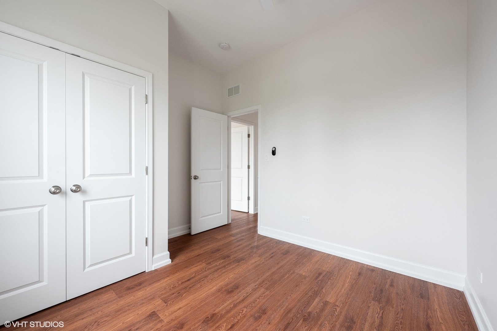 6036 North Broadway, Unit 3 Chicago, IL 60660 - Photo 12 of 17 a view of a hallway with wooden floor