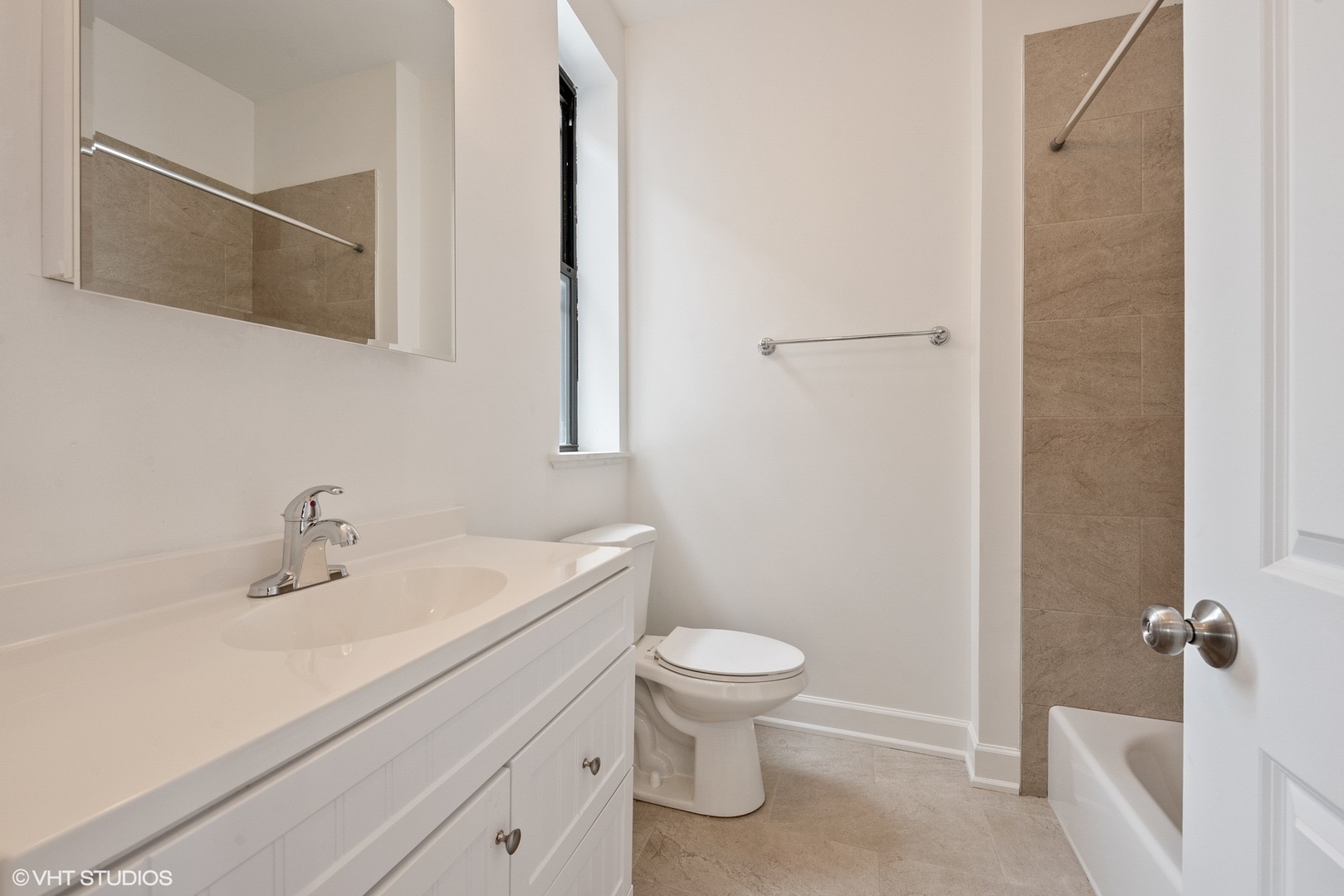6036 North Broadway, Unit 3 Chicago, IL 60660 - Photo 13 of 17 a bathroom with a sink a toilet and shower