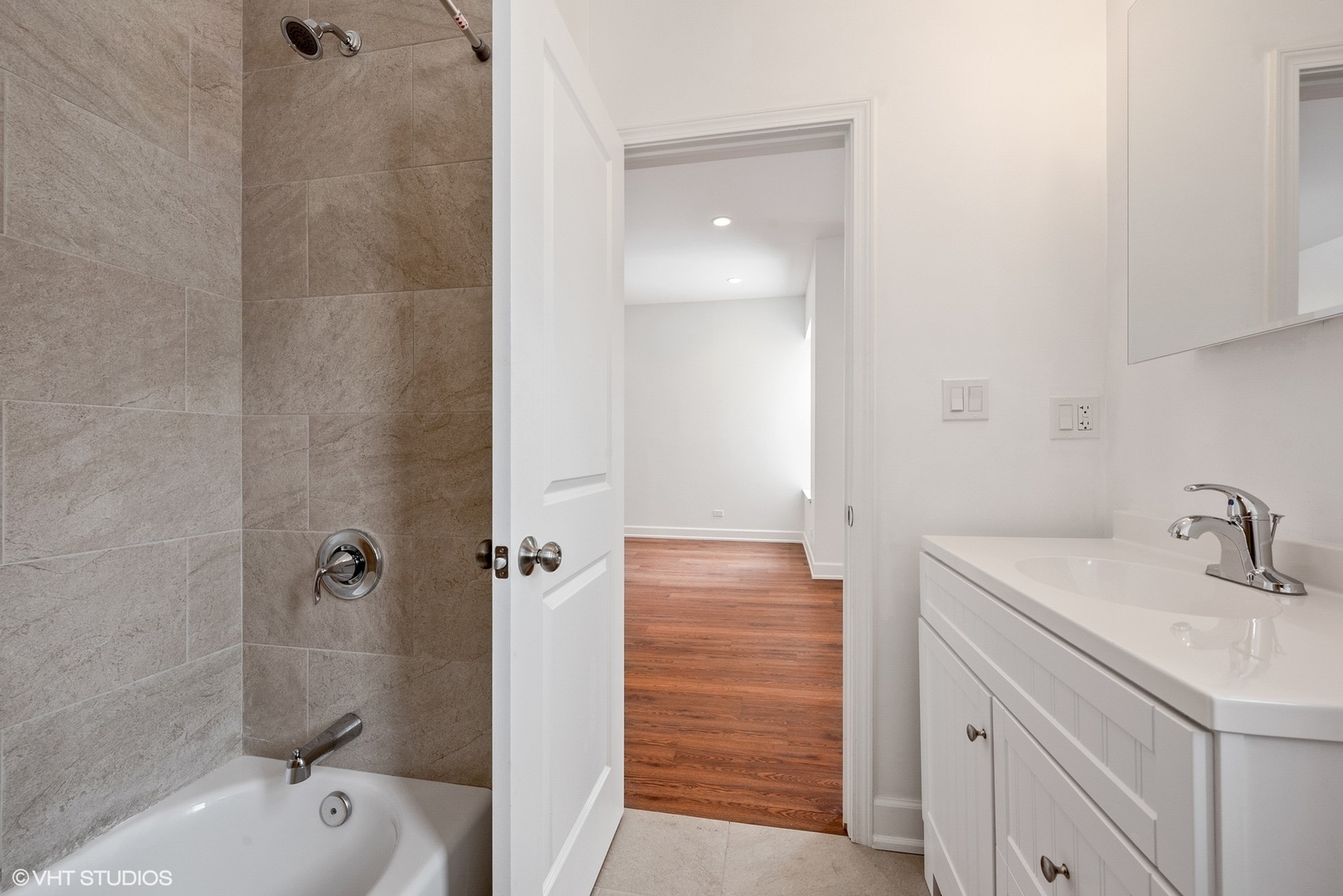 6036 North Broadway, Unit 3 Chicago, IL 60660 - Photo 14 of 17 a bathroom with a sink a toilet and shower