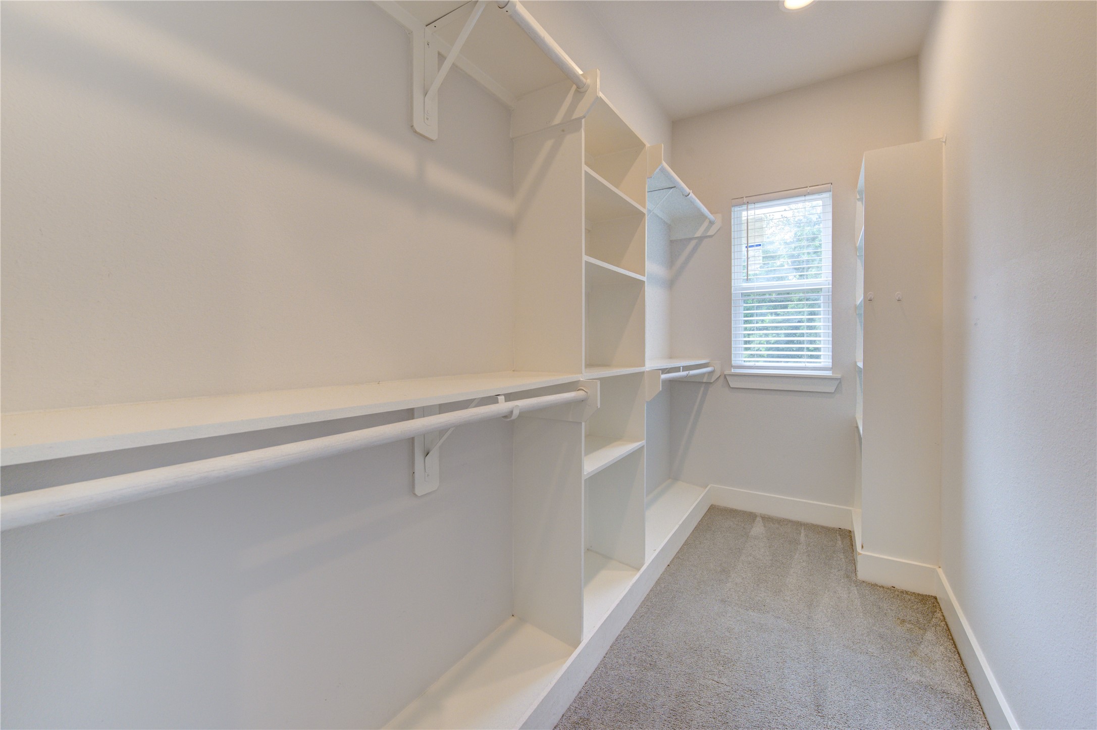847 Rachel Street, Unit G Houston, TX 77091 - Photo 31 of 42 Walkimg closet on primary bedroom is huge and has a window.