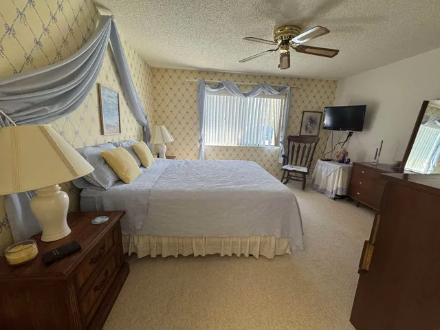 a bedroom with bed and window